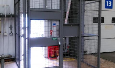 Restricted access to warehouse with drivers cage showing hatch closed