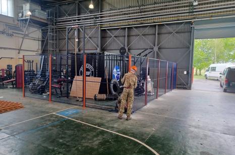 Three sided partition enclosed gym workout area